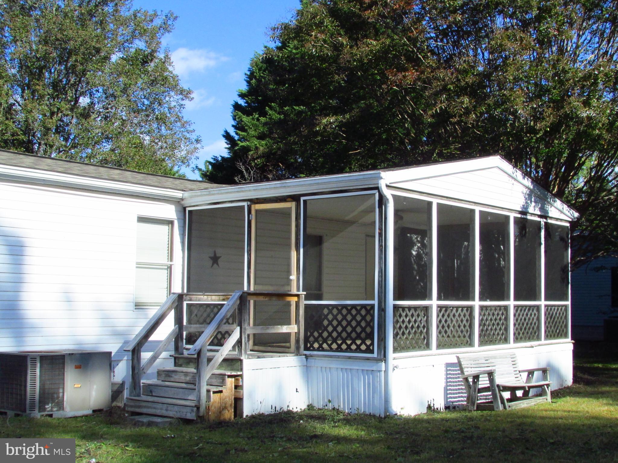 23 Ritter Drive Millsboro, DE 19966 - Photo 2 of 9 a front view of a house with a garden