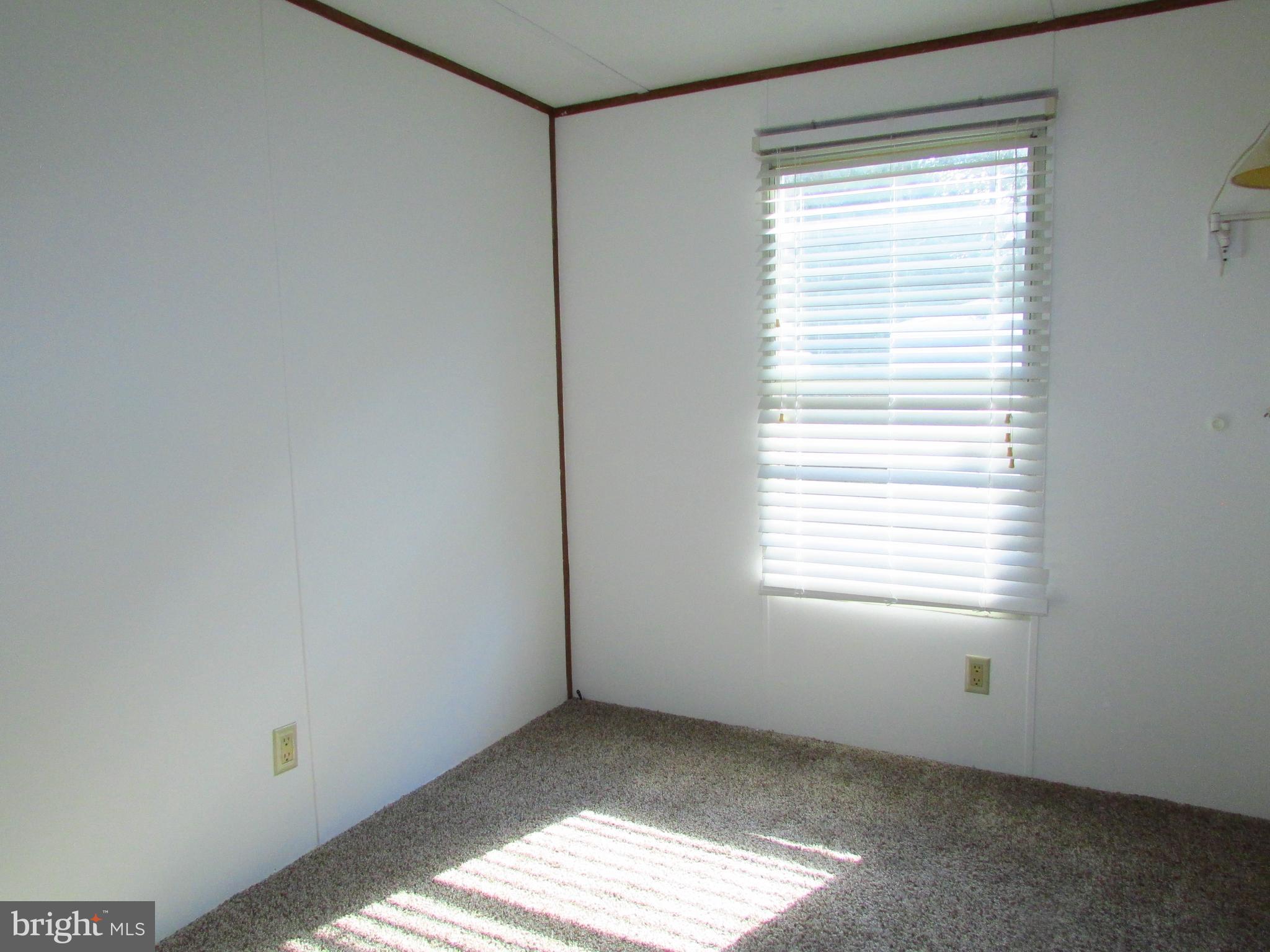 23 Ritter Drive Millsboro, DE 19966 - Photo 6 of 9 a view of an empty room with a window