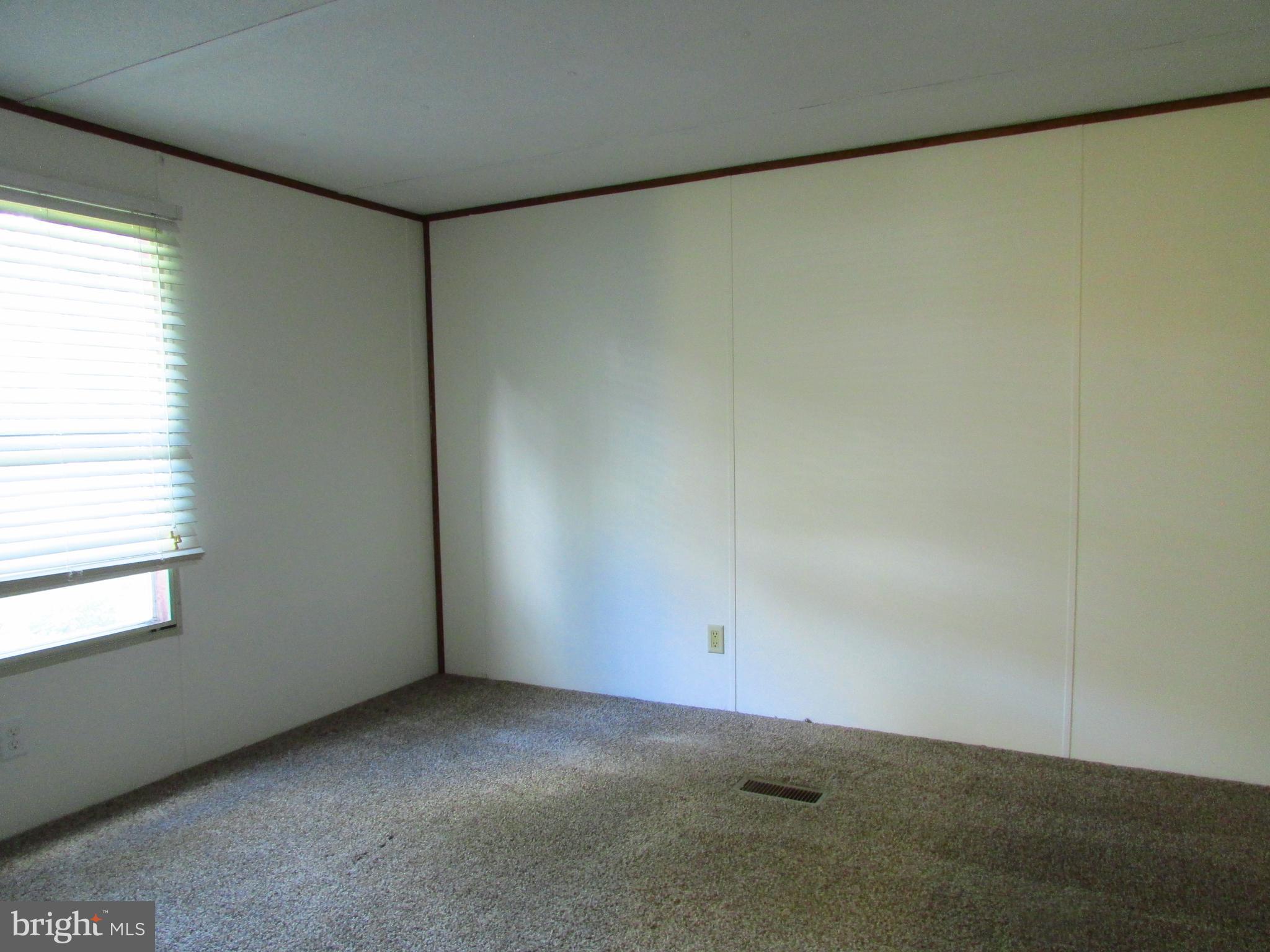 23 Ritter Drive Millsboro, DE 19966 - Photo 8 of 9 a view of an empty room with a window