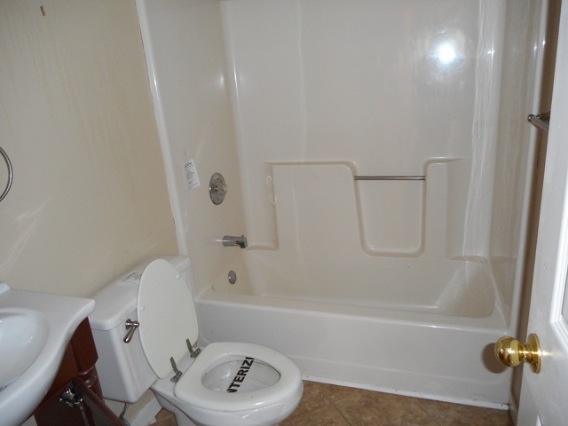 4201 Garth Road Charlottesville, VA 22901 - Photo 11 of 20 a bathroom with a bathtub a sink a toilet and a shower