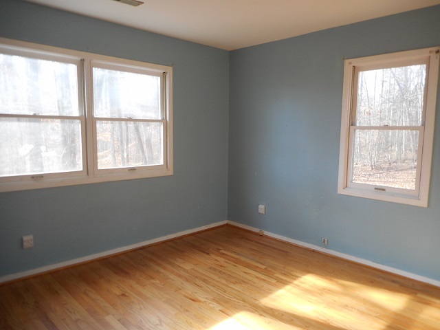 4201 Garth Road Charlottesville, VA 22901 - Photo 15 of 20 a view of an empty room with wooden floor and a window