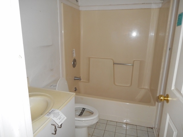 4201 Garth Road Charlottesville, VA 22901 - Photo 17 of 20 a bathroom with a granite countertop bathtub shower sink vanity and toilet