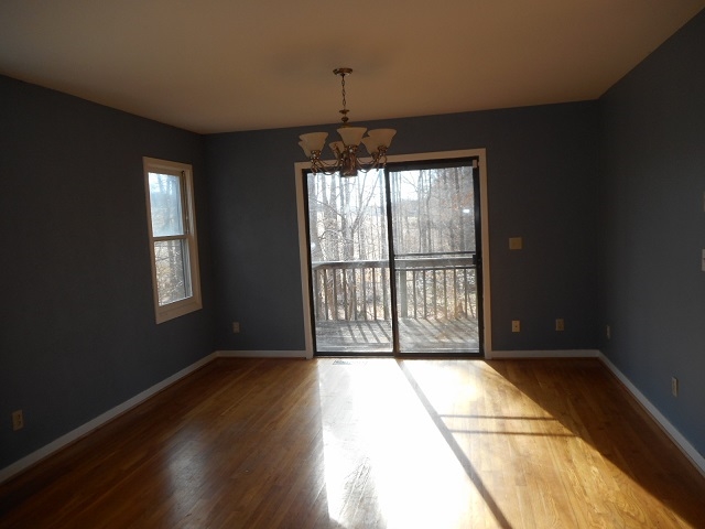 4201 Garth Road Charlottesville, VA 22901 - Photo 9 of 20 a view of empty room with wooden floor and fan