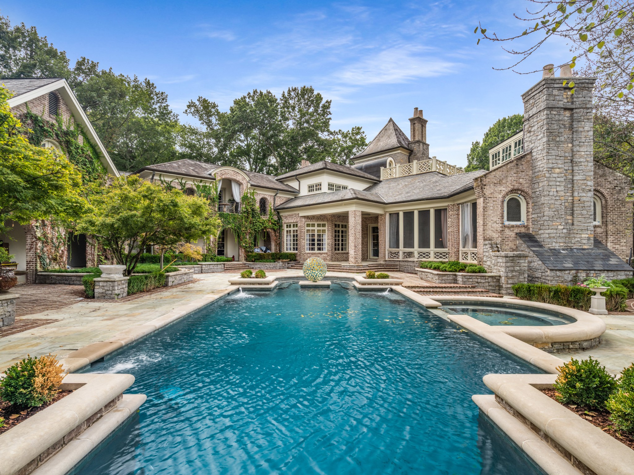 1358 Page Road Nashville, TN 37215 - Photo 34 of 35 a front view of a house with swimming pool having outdoor seating