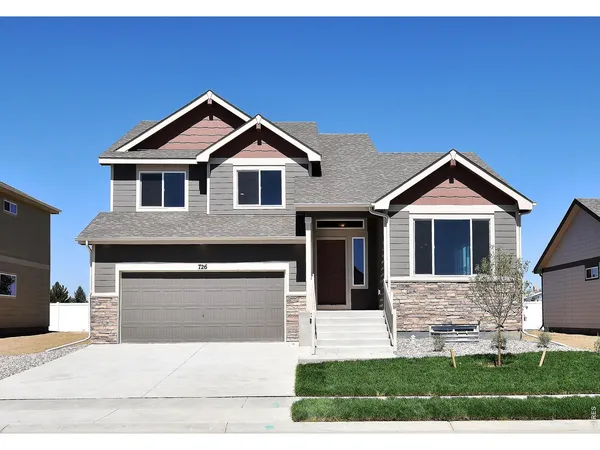 a front view of a house with yard