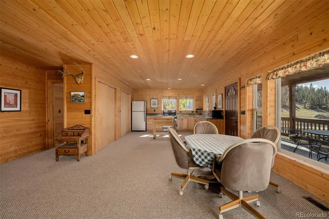 a view of a livingroom with furniture and a window
