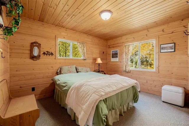 a bathroom with a toilet and a shower curtain