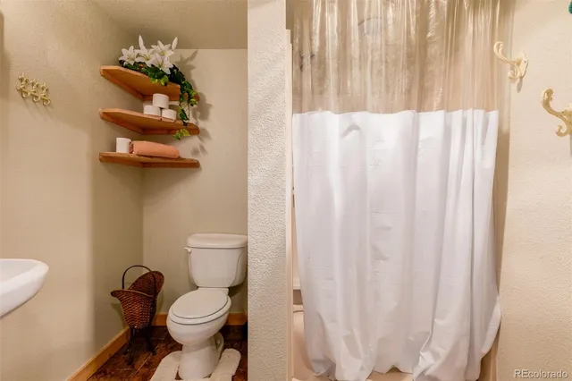 a bedroom with furniture and a ceiling fan