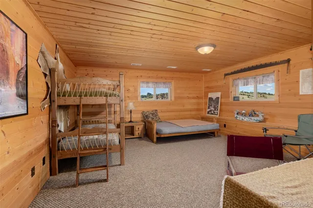 a view of a room with furniture and window