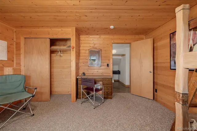 a living room with furniture and a ceiling fan