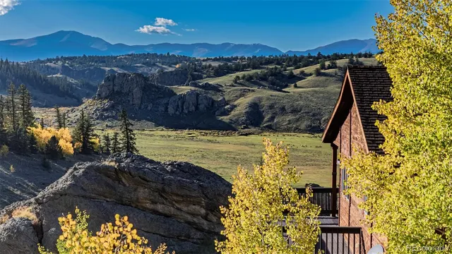 a backyard of a house with a mountain