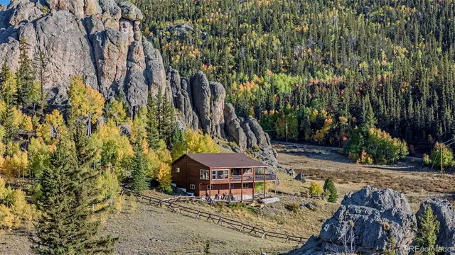 a view of a yard with wooden fence