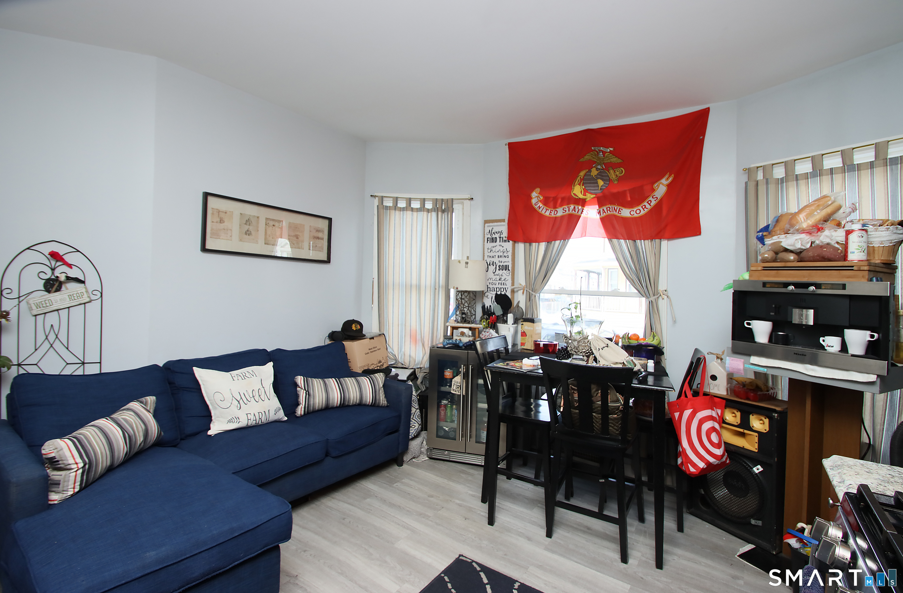 750 William Street Bridgeport, CT 06608 - Photo 11 of 35 a living room with furniture a rug and a lamp