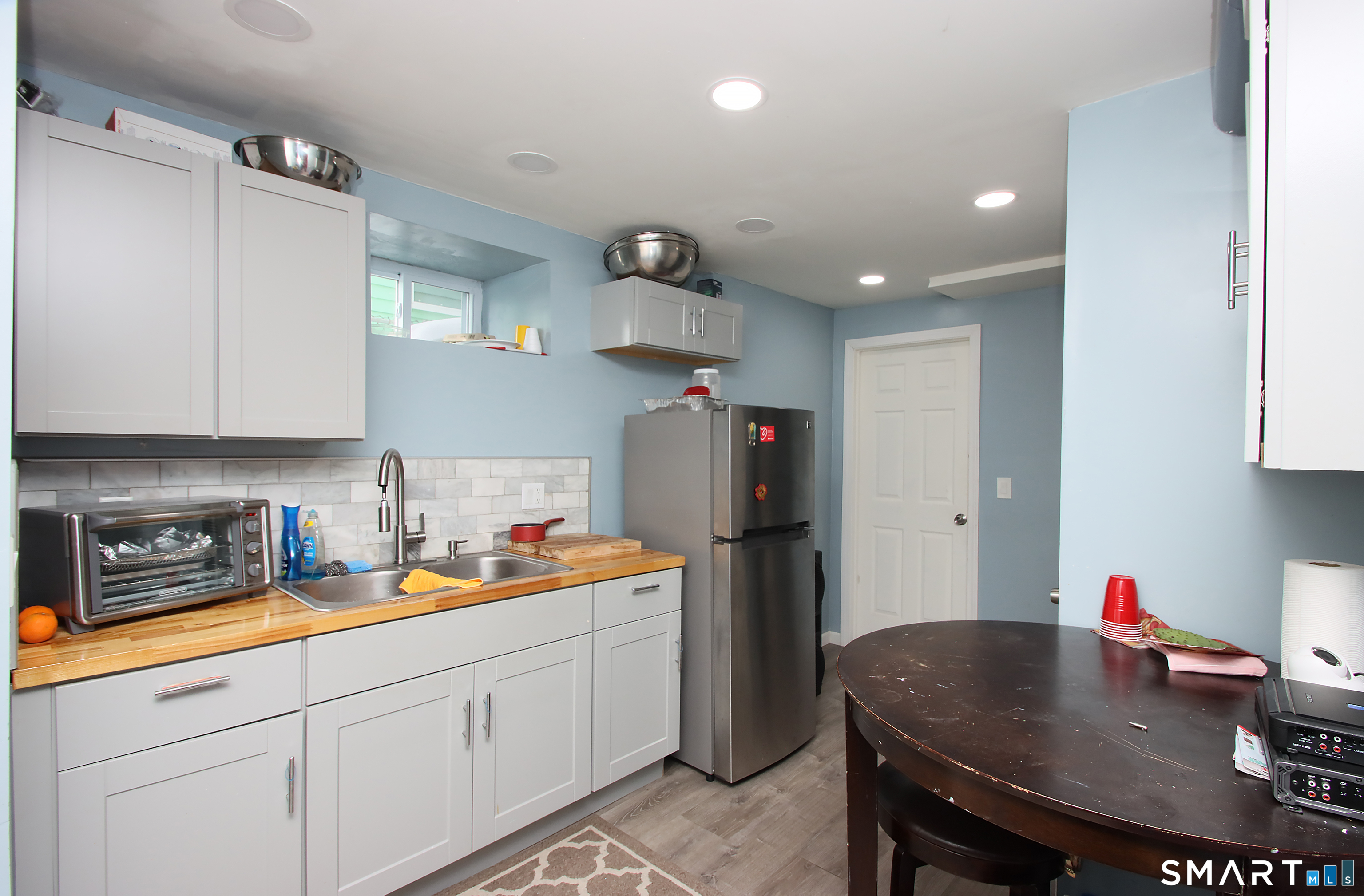 750 William Street Bridgeport, CT 06608 - Photo 12 of 35 a kitchen with a sink a stove and cabinets