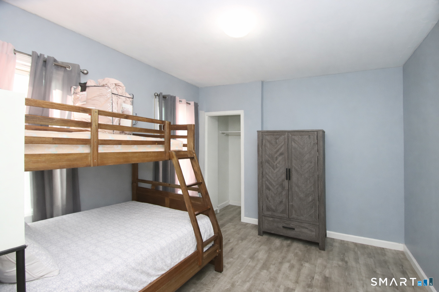 750 William Street Bridgeport, CT 06608 - Photo 15 of 35 a bedroom with a bed and a window