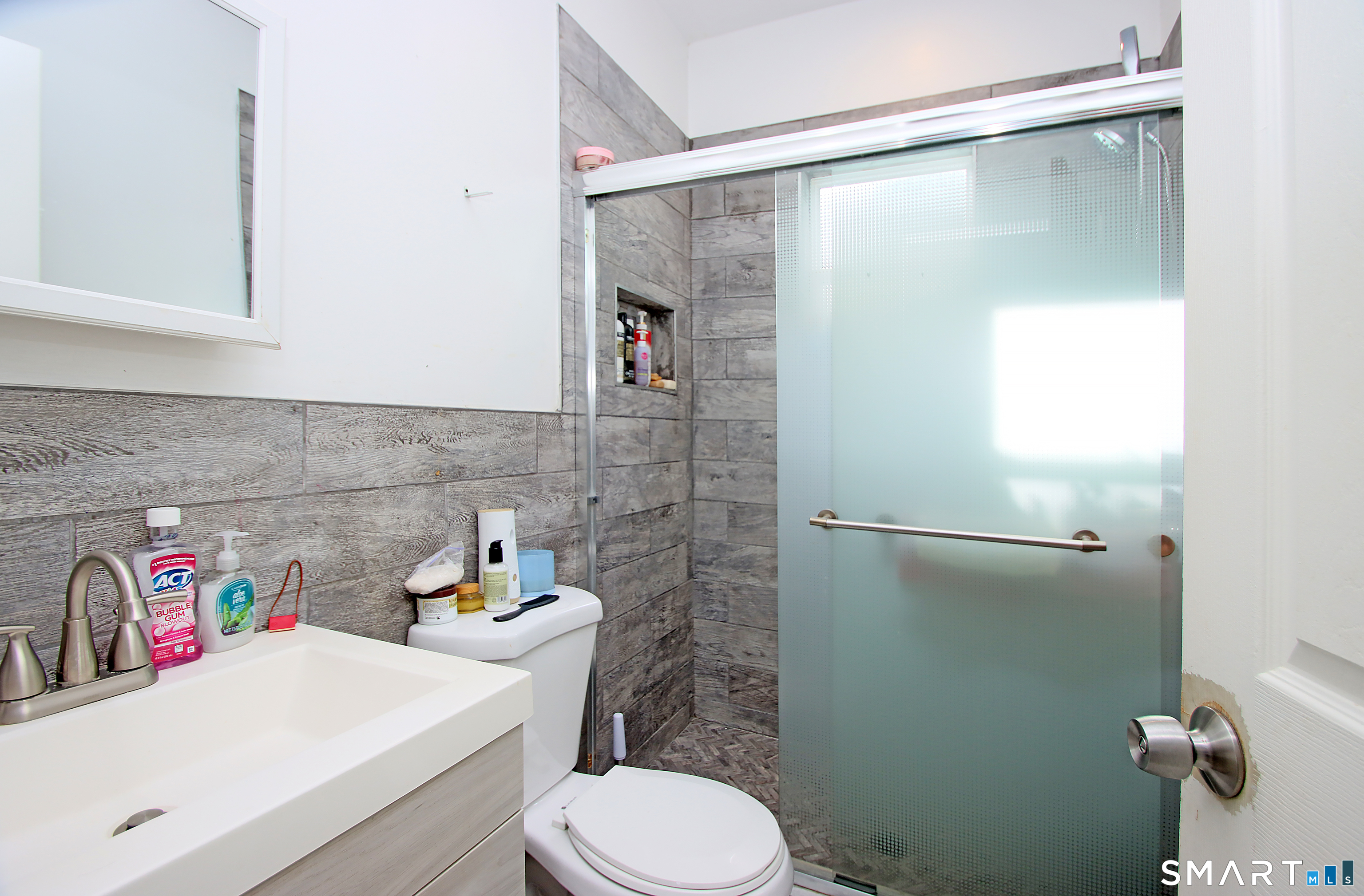 750 William Street Bridgeport, CT 06608 - Photo 23 of 35 a bathroom with a sink a toilet and shower