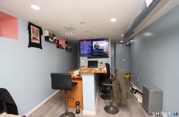 a workspace with furniture and screen