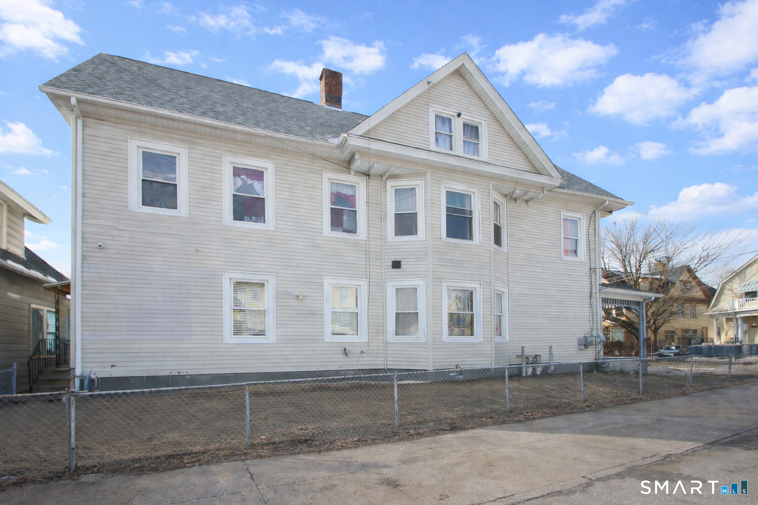 750 William Street Bridgeport, CT 06608 - Photo 6 of 35 a front view of a house with a yard