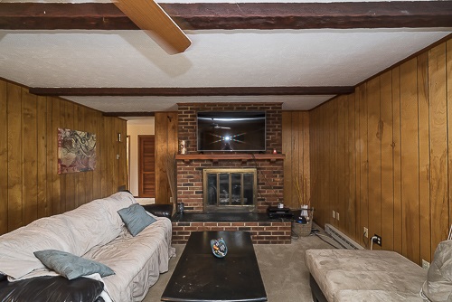 3629 Rockfish Road Grottoes, VA 24441 - Photo 22 of 32 a living room with furniture and a fireplace