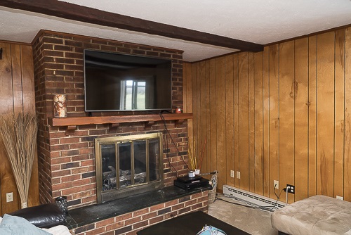 3629 Rockfish Road Grottoes, VA 24441 - Photo 23 of 32 a living room with a fireplace furniture and a window