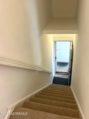 a bedroom with a bed and a mirror