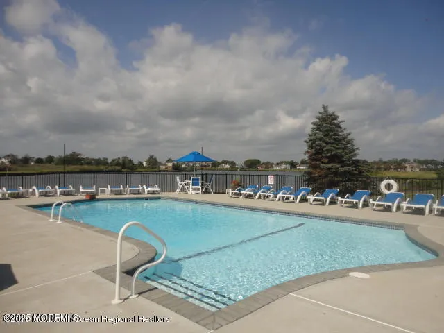 a terrace with outdoor seating city view and barbeque oven