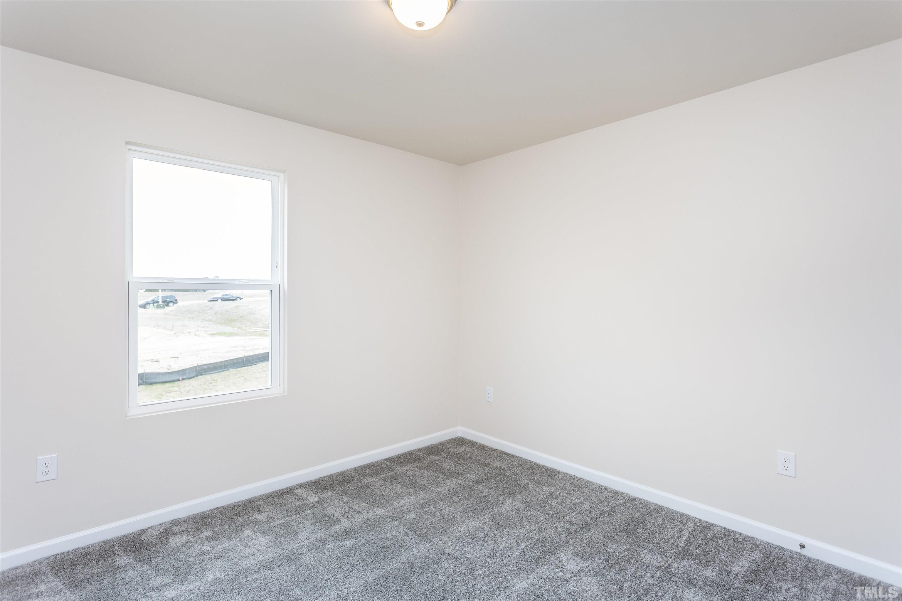 3469 Dragonfly River Raleigh, NC 27604 - Photo 25 of 26 an empty room with a window