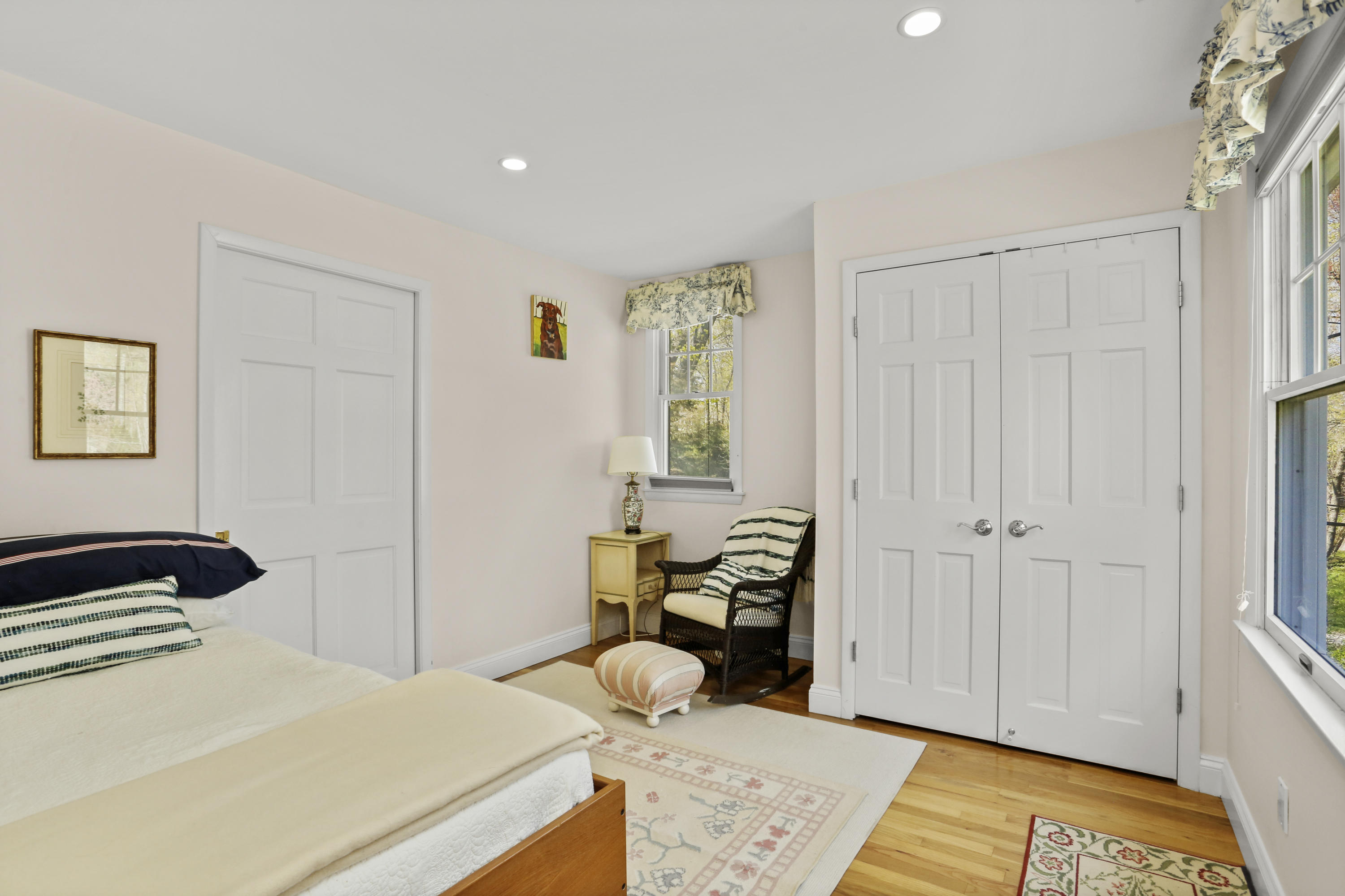 23 Fairmead Road Darien, CT 06820 - Photo 26 of 47 a bedroom with a bed and wooden floor