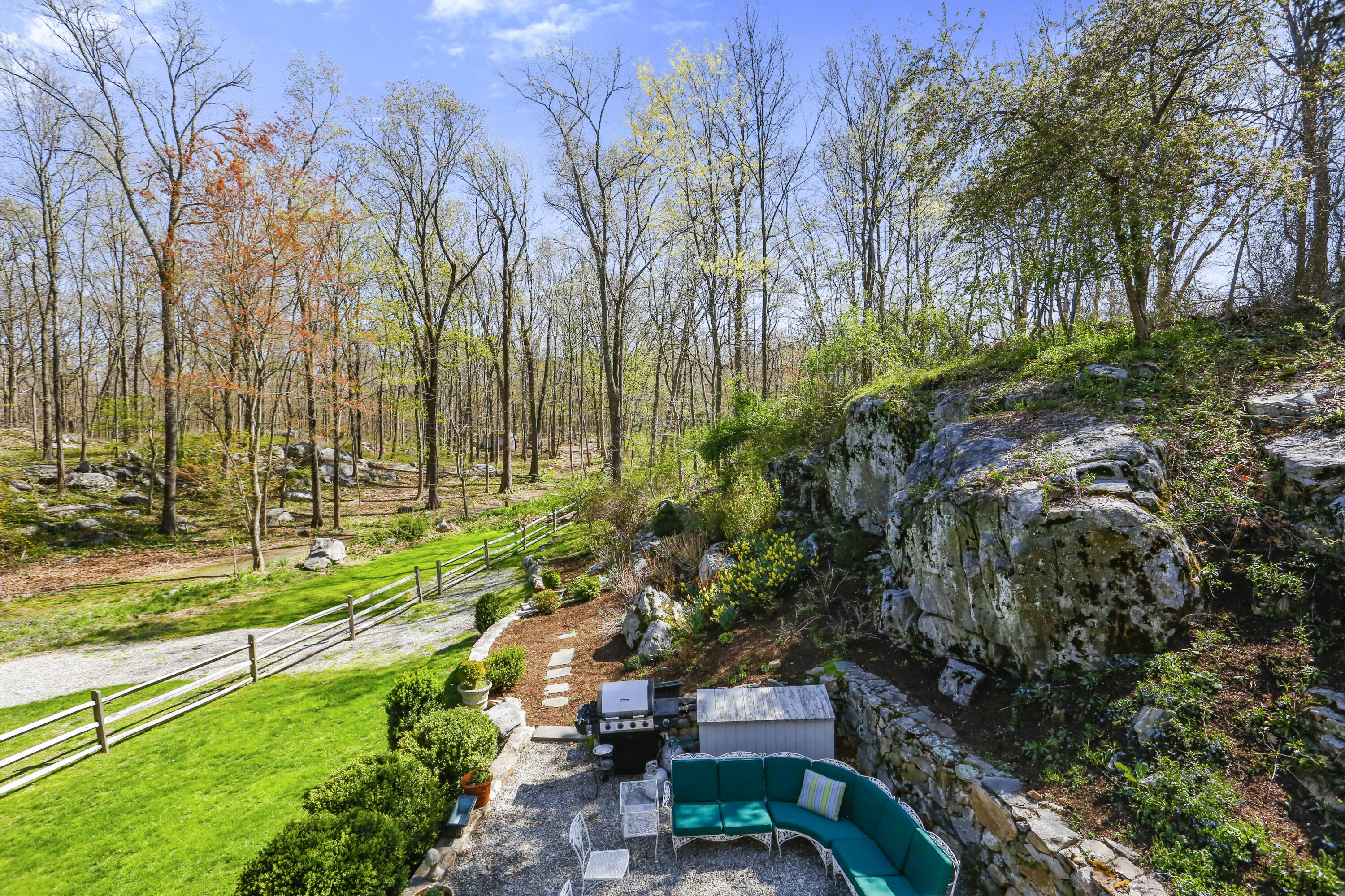 23 Fairmead Road Darien, CT 06820 - Photo 32 of 47 a backyard of a house with outdoor seating and trees