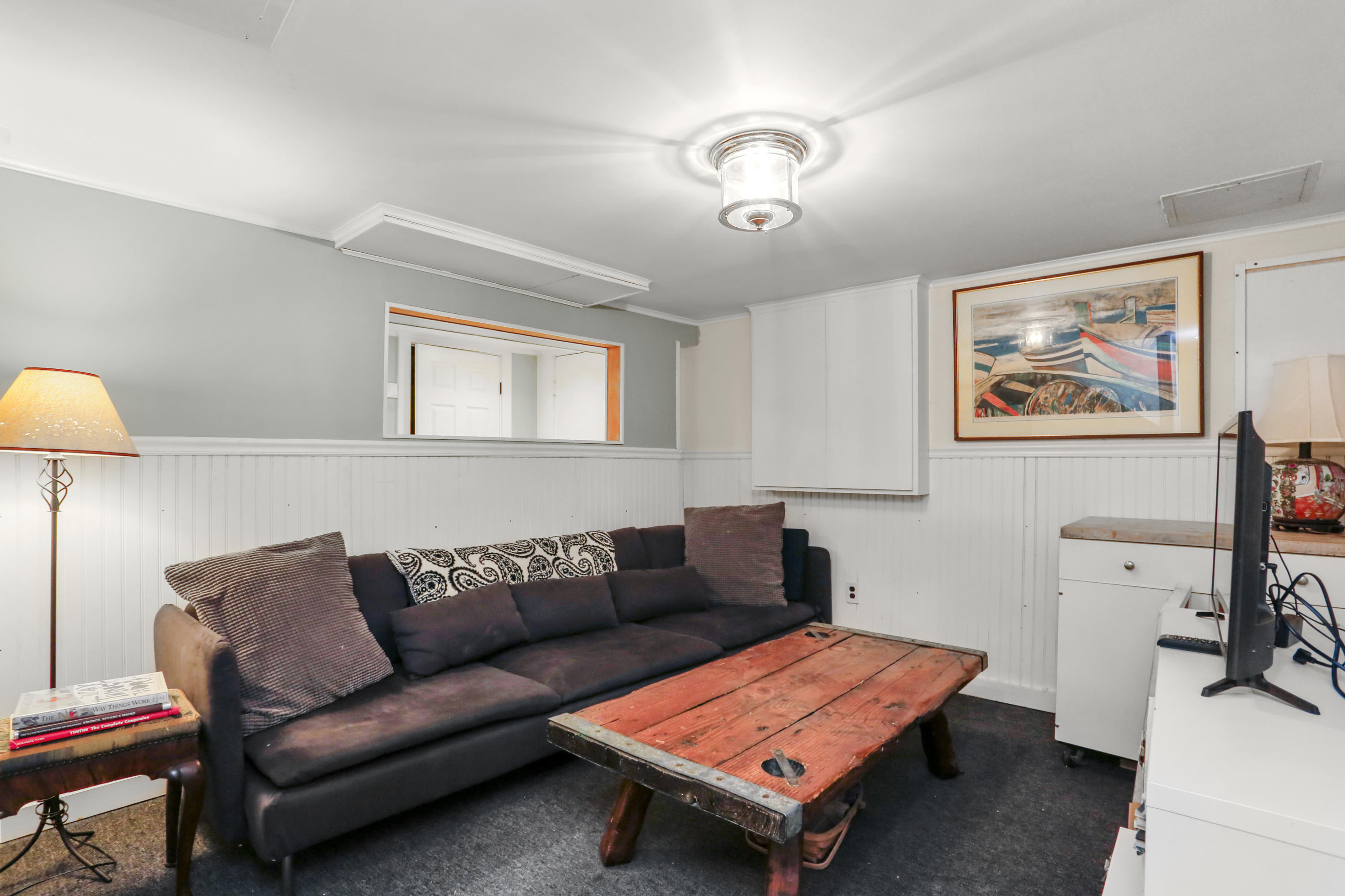 23 Fairmead Road Darien, CT 06820 - Photo 33 of 47 a living room with furniture and a flat screen tv