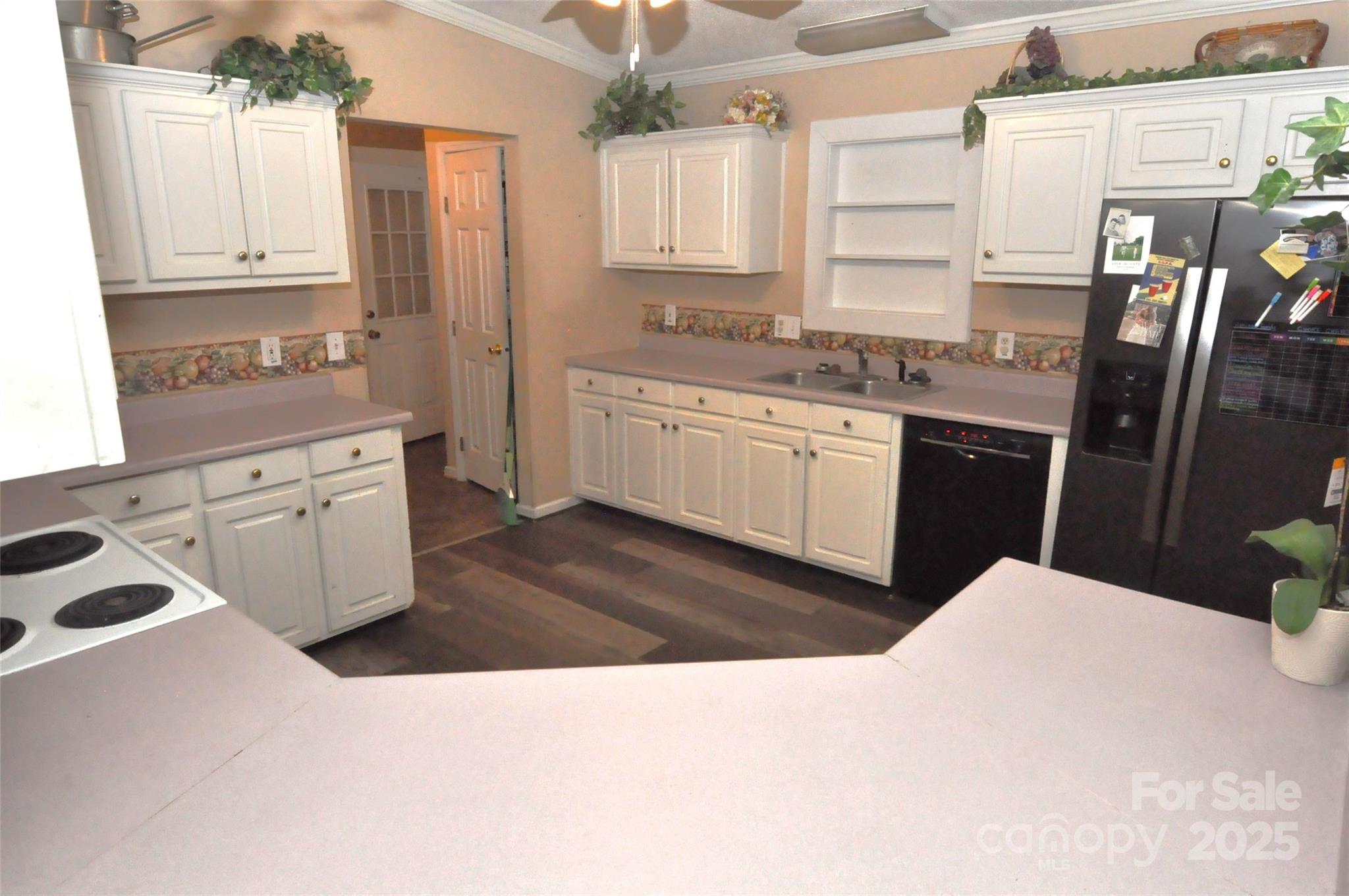 1126 Williamsville Church Road Chester, SC 29706 - Photo 8 of 33 a kitchen with stainless steel appliances kitchen island granite countertop a sink refrigerator stove and white cabinets