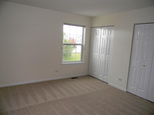 1782 Prairie Ridge Circle Lindenhurst, IL 60046 - Photo 13 of 15 an empty room with windows