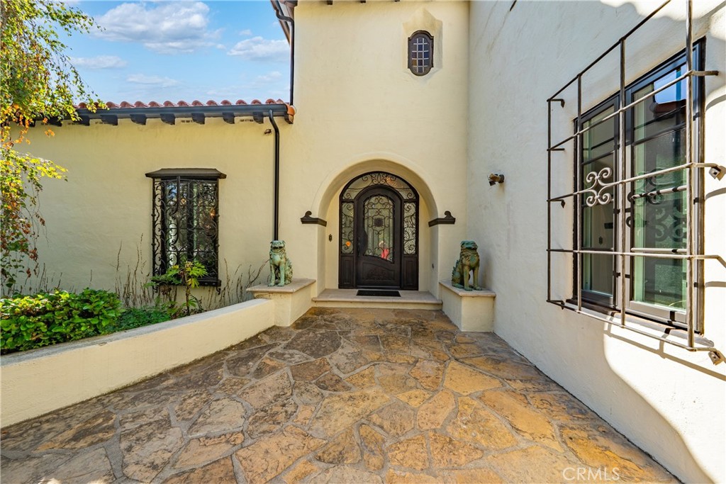 1591 Virginia Road San Marino, CA 91108 - Photo 2 of 74 a view of a brick house with a large window