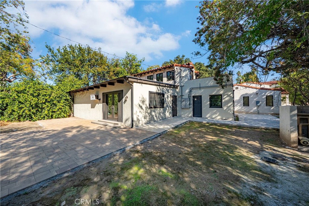 1591 Virginia Road San Marino, CA 91108 - Photo 25 of 74 a front view of a house with a garden