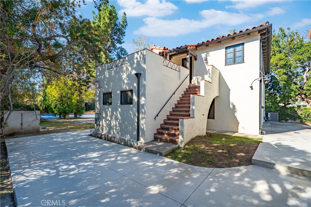1591 Virginia Road San Marino, CA 91108 - Photo 26 of 74 a view of a house with a small yard and a large tree