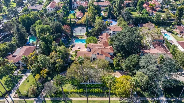 an aerial view of house with swimming pool outdoor seating and yard
