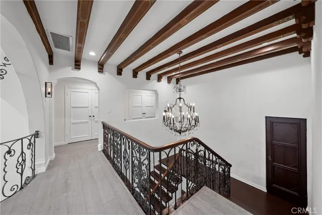 a kitchen with stainless steel appliances a sink a stove a refrigerator cabinets and a counter top space