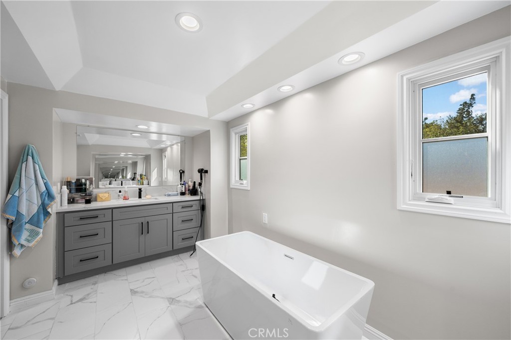 1591 Virginia Road San Marino, CA 91108 - Photo 43 of 74 a bathroom with a tub sink and mirror