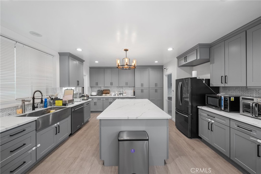 1591 Virginia Road San Marino, CA 91108 - Photo 45 of 74 a kitchen with stainless steel appliances a sink dishwasher a refrigerator and cabinets with wooden floor