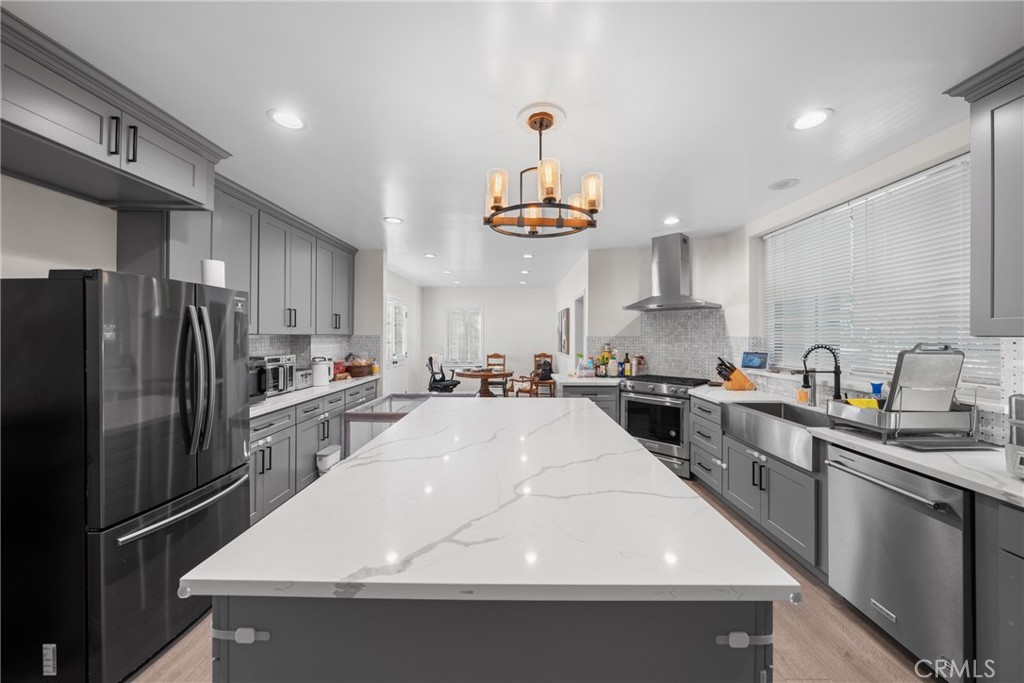 1591 Virginia Road San Marino, CA 91108 - Photo 47 of 74 a kitchen with stainless steel appliances a sink a stove a refrigerator cabinets and a counter top space