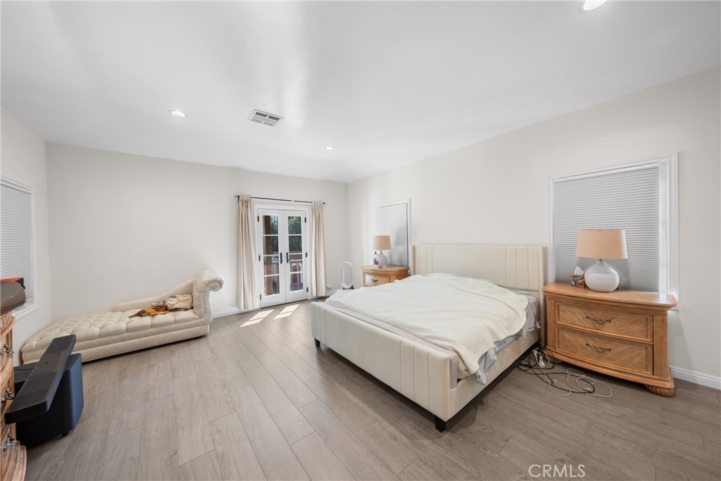 1591 Virginia Road San Marino, CA 91108 - Photo 48 of 74 a spacious bedroom with a bed and window