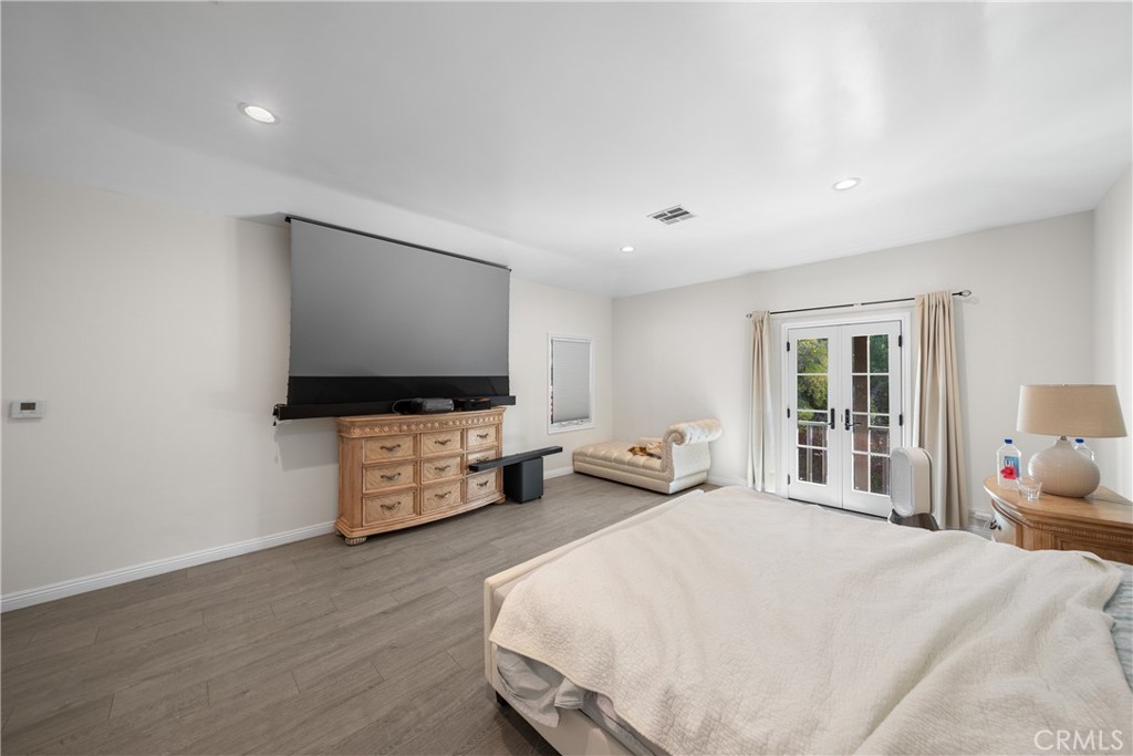 1591 Virginia Road San Marino, CA 91108 - Photo 49 of 74 a bedroom with a bed and flat screen tv