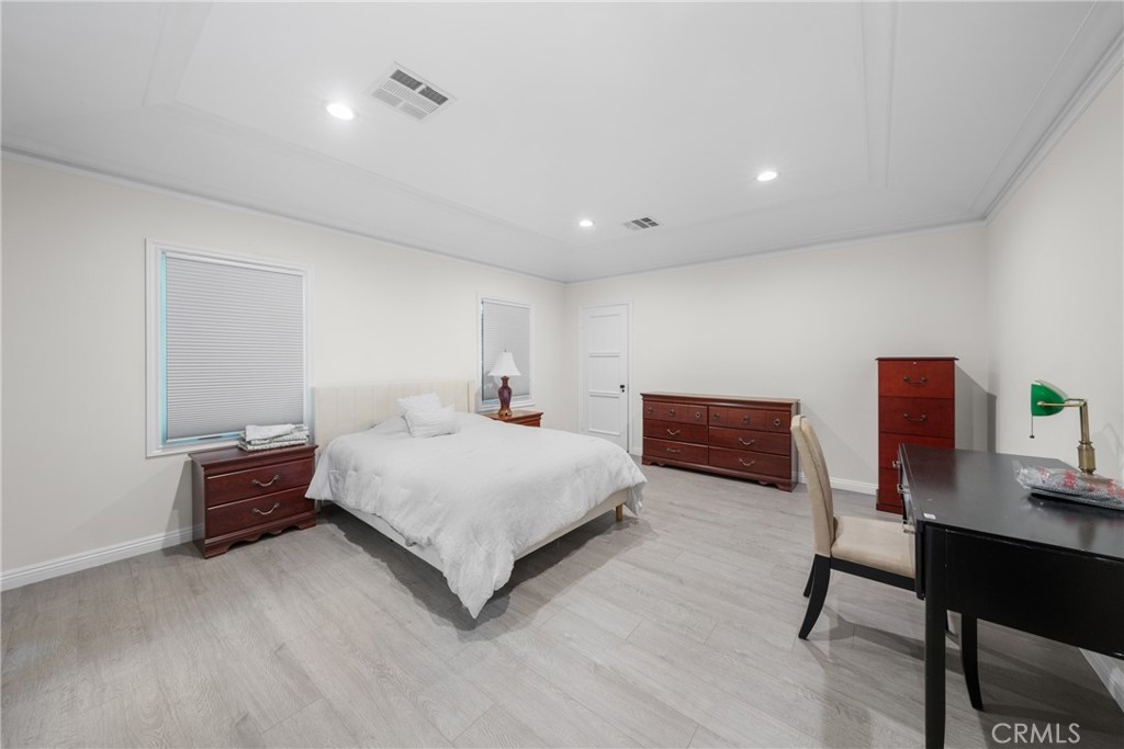 1591 Virginia Road San Marino, CA 91108 - Photo 51 of 74 a spacious bedroom with a bed and a desk