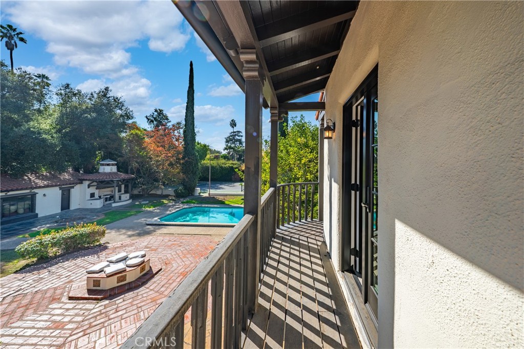 1591 Virginia Road San Marino, CA 91108 - Photo 52 of 74 a porch with seating space and hardwood floor