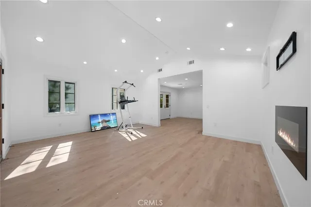 a kitchen with stainless steel appliances granite countertop a stove and a refrigerator