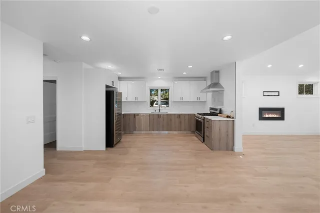 a view of a big room with windows and cabinet