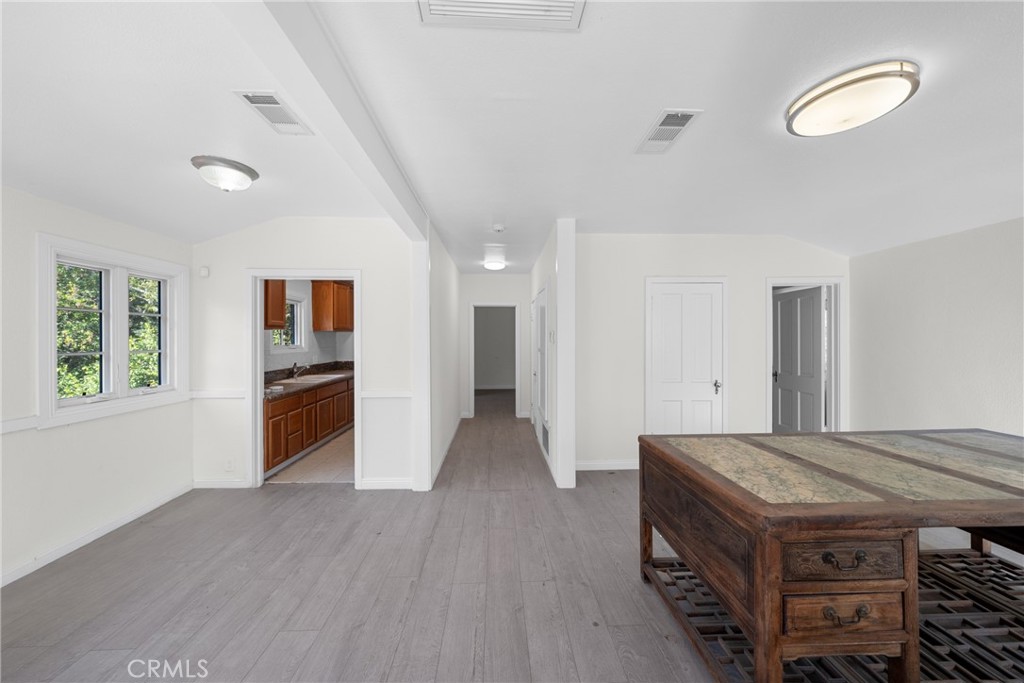 1591 Virginia Road San Marino, CA 91108 - Photo 62 of 74 a kitchen with stainless steel appliances granite countertop a stove and a refrigerator