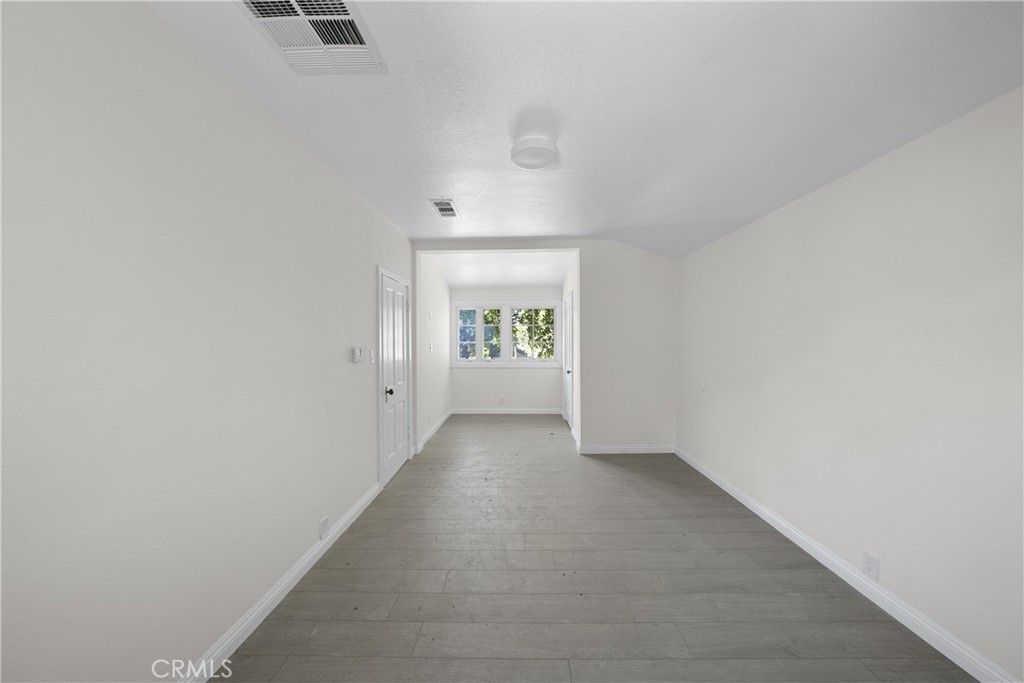 1591 Virginia Road San Marino, CA 91108 - Photo 69 of 74 an empty room with windows and closet