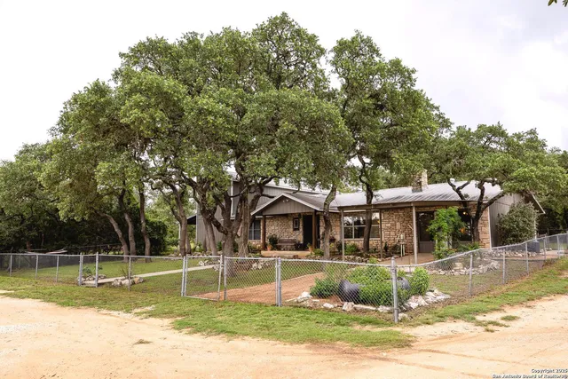 a view of house with a swimming pool