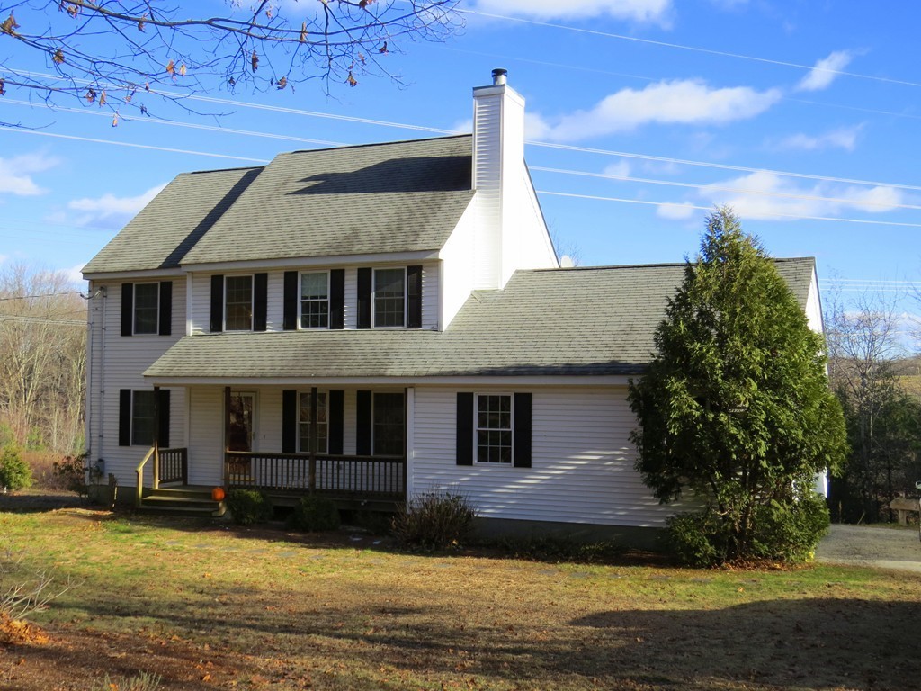 11 Smith Road Sutton, MA 01590 - Photo 2 of 11 a front view of a house with a yard